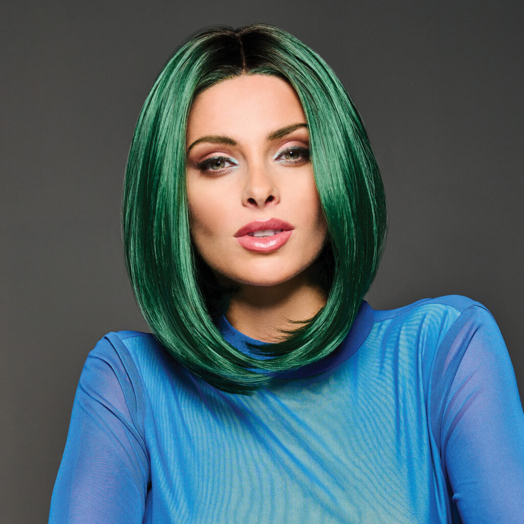 Model wearing Green IRL by Hairdo fantasy wigs collection